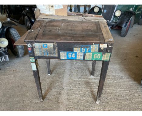 An early 20th Century desk with rising lid, as removed from a garage and still with sundry advertising contents, 35" w (exclu