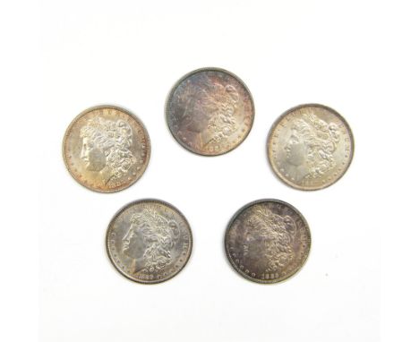 Five United States of America silver Morgan dollar coins, dated 1882, 1883, 1884 O, 1885 and 1889
