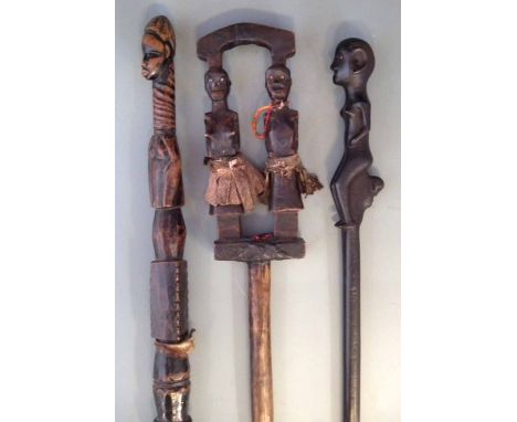 Mende staff, another staff carved with a pair of figures possibly Namwezi and spear carved with a single figure, the largest 