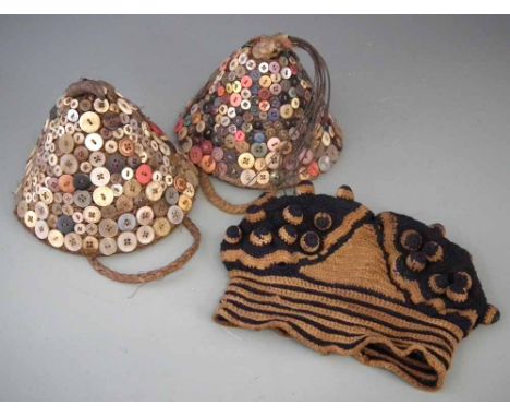 Two Bwami button hats, also a Bamileke knitted hat, the button hats measure 19cm diameter All lots in this Tribal and African