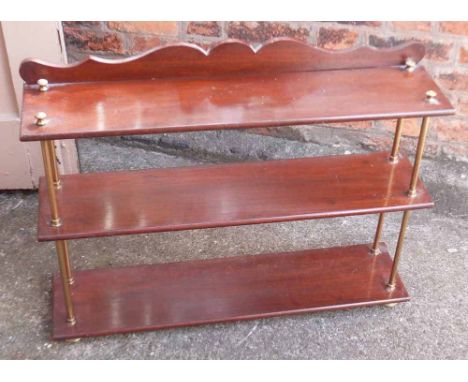 19th century mahogany three tier shelf with brass feet, support rails and finials. Condition report: see terms and conditions
