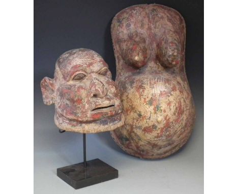 Makonde helmet mask and a similar pregnancy belly mask, the belly mask measures 54cm high     All lots in this Tribal and Afr
