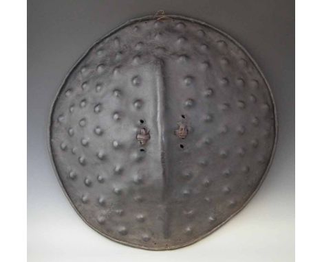 Ethiopian hide shield, 67cm diameter     All lots in this Tribal and African Art Sale are sold subject to V.A.T. Therefore £1