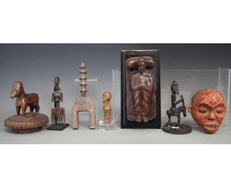 Collection of items carved in various tribal styles, to include a heddle pulley, small figure, comb, pot lid, equestrian figu