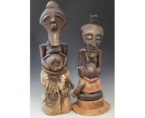 Two Songye Nkisi Power figures, the tallest measures 72cm high     All lots in this Tribal and African Art Sale are sold subj