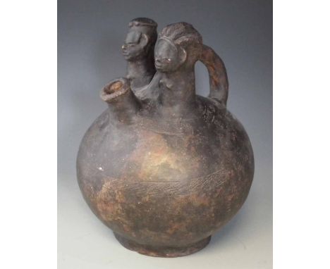 Large terracotta twin headed palm wine vessel possibly Luba, 34cm high     All lots in this Tribal and African Art Sale are s