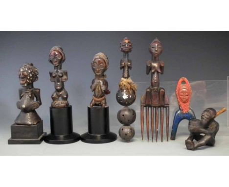 Two Luba / Hemba figures and a comb and rattle, also a figural pipe, a slingshot and a Songye figure, the tallest measures 27