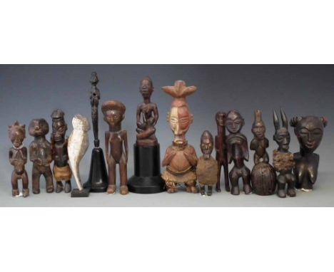 Fourteen African figures carved in various tribal styles, the tallest measures 25cm high     All lots in this Tribal and Afri