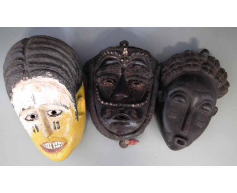 Bete - Guere mask, a Baule mask and one other painted Ivory coast mask, the largest measures 33cm high    All lots in this Tr