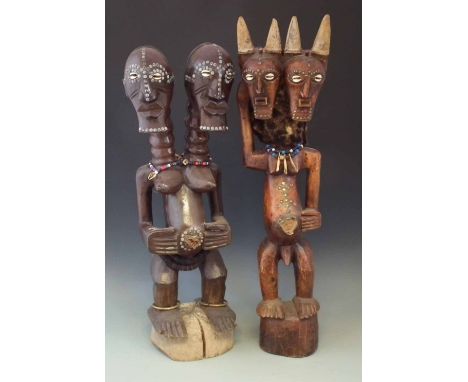 Two Songye Nkisi double headed power figures, the tallest measures 86cm high     All lots in this Tribal and African Art Sale