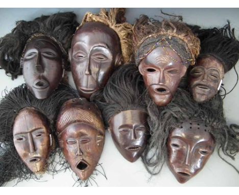 Eight masks carved in Chokwe and similar tribal styles, the largest measures 28cm high     All lots in this Tribal and Africa