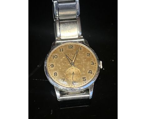 A vintage Cyma watch currently ticking 