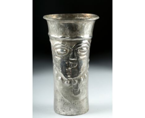 Pre-Columbian, South Coast Peru, Inca, ca. 1200 to 1500 CE. A silver kero or drinking vessel hammered into a beaker shape wit