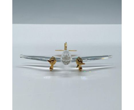 Beautiful facetted clear crystal with gold-toned metal details. Swarovski etched mark on base. This item has its original box