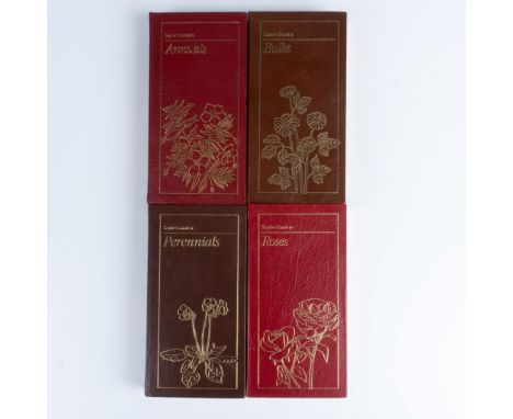 A set of 4 leather colored covered books with caramel-brown fabric bookmark ribbons. The set includes: Roses; Bulbs; Perennia