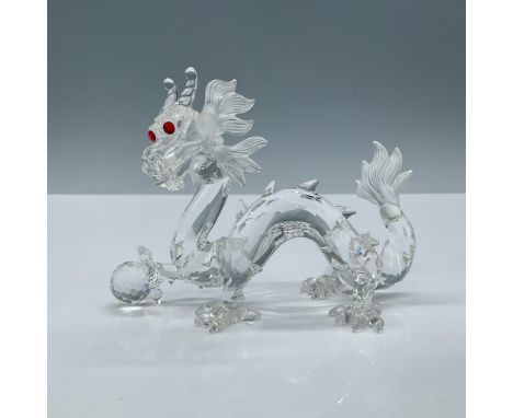 Faceted clear crystal cut figure with ruby glass eyes from the Fabulous Creatures collection. Etched Swarovski mark on tail. 