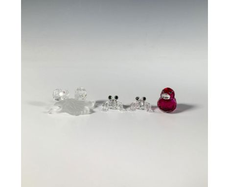 Four faceted crystal decorations including a figure of two snails perched on a frosted leaf, two miniature baby frogs, and a 