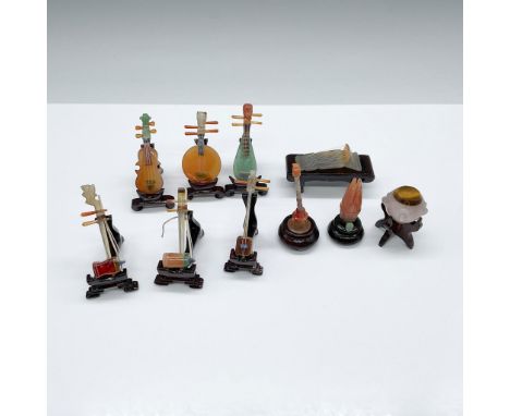 A set of 10 traditional Chinese musical instrument figurines, each crafted from a variety of semi-precious, including jade, a