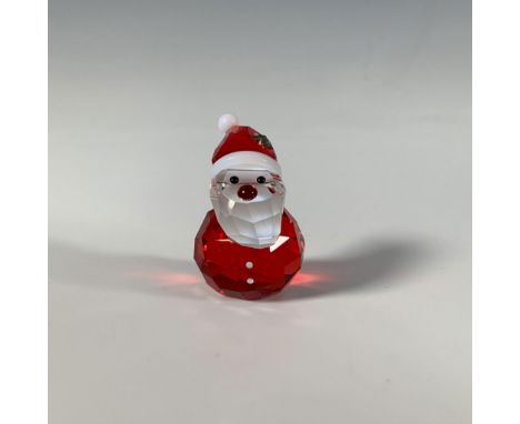 A sweet faceted crystal figure of Santa Claus with a smooth red nose and a star on his hat. Swarovski marking. This item has 