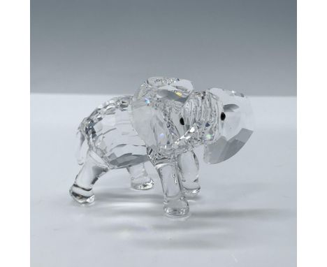 Beautiful faceted clear crystal baby elephant figure with jet black eyes. Swarovski acid backstamp. This item has its origina
