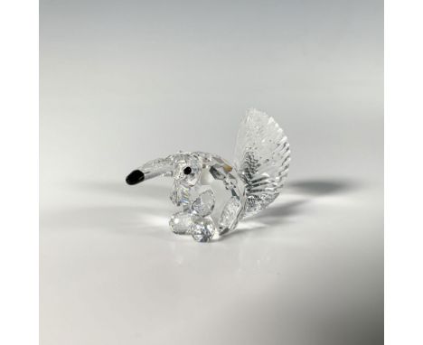 A sparkling small figure of an anteater, crafted from brilliant-cut crystal, accented with a black nose and eyes. Swarovski a