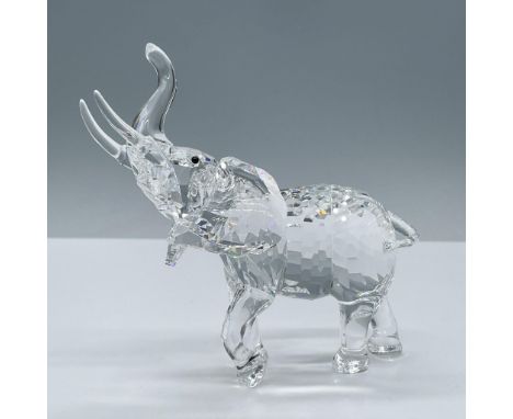 Beautiful clear faceted crystal body with black button crystal eyes with trunk up. Swarovski swan mark. This item has its ori
