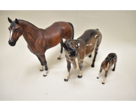 A Beswick Mare 976 in brown gloss, Foal 1816 in brown gloss, a Goebel horse