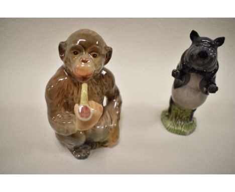 A Beswick figure study of a pipe smoking monkey no. 1049 and similar pig