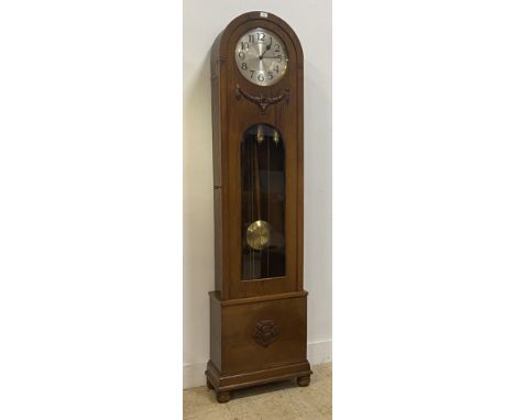 A 1930's oak longcase clock, silvered dial with Arabic chapter ring, eight day triple train Wesminster chiming movement, comp