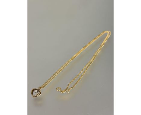 A 18ct gold open heart shaped pendant with diamond point L x 1cm on 18ct gold curb link chain necklace with ring fastening a/