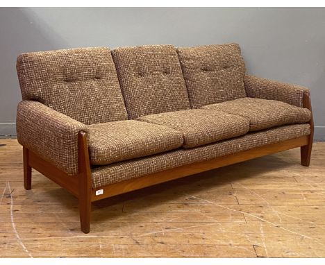 A mid century upholstered teak framed three seat sofa, with squab cushions and raised on tapered supports. H80cm, L176cm, D90
