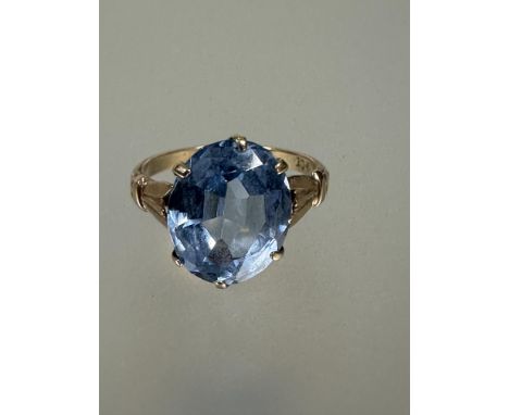 A 9ct gold solitaire topaz ring the oval cut stone mounted in six claw setting approximately 3ct K/L 2.74g&nbsp;