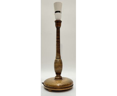 A 1920s stained beech turned wood baluster candlestick lamp raised on circular base on bun feet H x 32cm D x 13.5cm&nbsp;