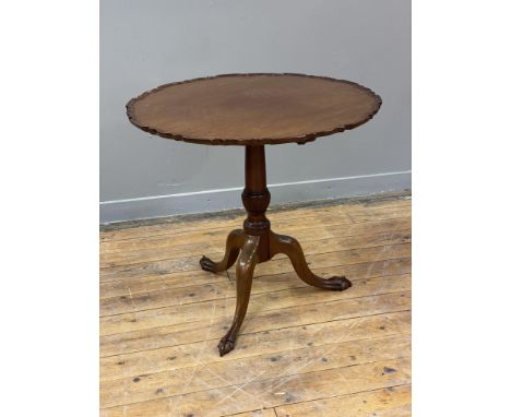 A 19th century mahogany tilt top table, the circular top with raised and moulded edge above a ring turned and reeded column, 