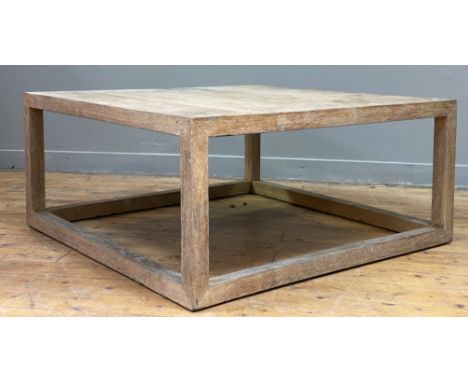 A Vintage dry oak coffee table of square form, the plank top raised on square section supports united by floor stretchers. H4