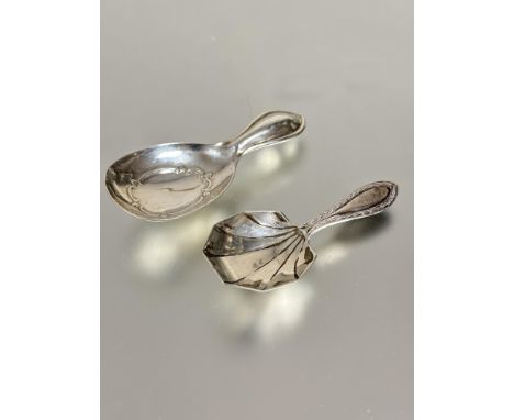 An Edwardian Birmingham silver Art Nouveau style caddy spoon with stylized design an handle L x 8cm Birmingham 1912 and a Bir