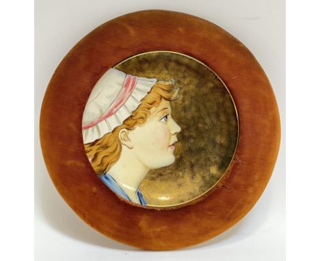 A Victorian framed Pinder Bourne Burslem dish decorated with side profile portrait of a girl (textile frame, impressed and lo