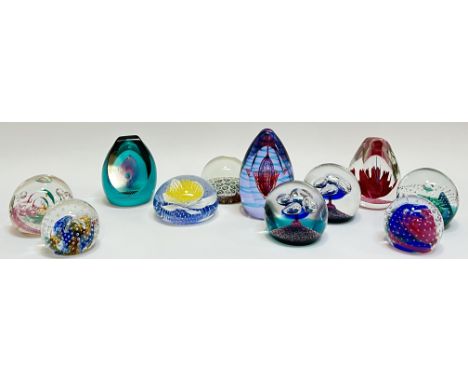 A group of ten Caithness art glass paperweights of various shapes and designs including conical and spherical forms etc...(ta
