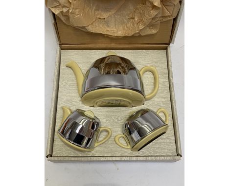Kosy Kraft, a vintage yellow ceramic and chrome three piece tea service, circa 1940's / 50's, in original box.&nbsp;