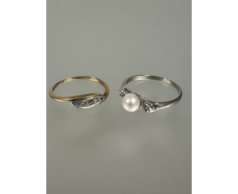 A 10k white gold dress ring set cultured pearl flaked by diamond points P/Q 1.73g and an 18ct gold set set three diamond poin