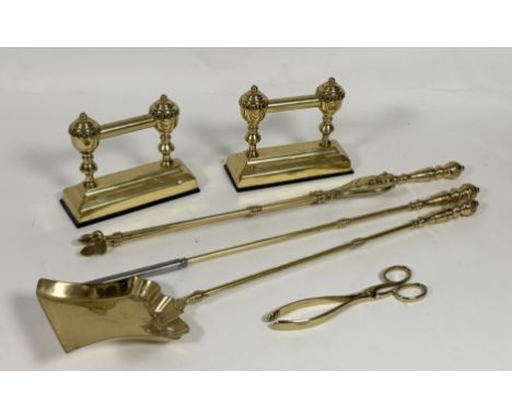 A cast brass fireplace companion set comprising, a ash pan, a fire tongs, a poker, coal scissors and a pair of firedogs andir