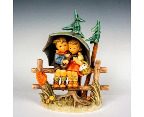 Limited edition, hand painted in matte finish. Depicts two children seated on a fence, enjoying the rain showers. Goebel back