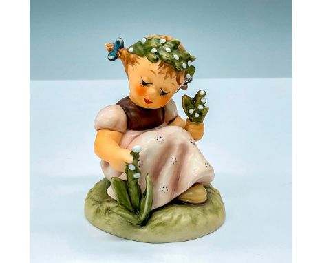 Charming Hummel HUM835 porcelain figure of a girl in a garden, picking blossoms and wearing a floral tiara, capturing the ess
