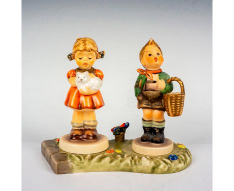 Hand painted in matte finish that includes A Girl's Best Friend and Village Boy. They boy stand on a floral base. Goebel back