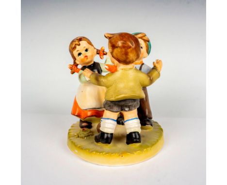 Hand painted in matte finish figure in the style of Goebel-Hummel. This charming figurine depicts three German children danci