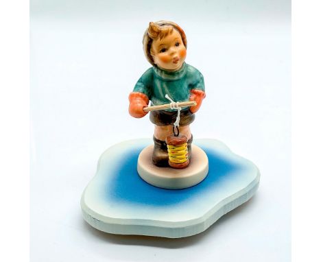 Hand painted boy in red mittens holding a lantern. Goebel Germany backstamp. This item has a base included, 4"Lx 3"W x 0.25"H