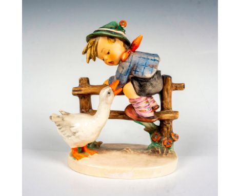Hand painted in matte finish. Modeled as a young boy on a fence while a wild goose attacks him. Goebel backstamp. Dimensions: