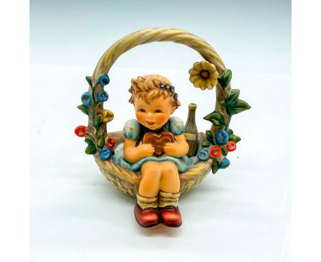 First Issue 2002. Hand painted girl in an oversized basket. Goebel Germany backstamp. Impress mark 618. Issued: 2002Dimension