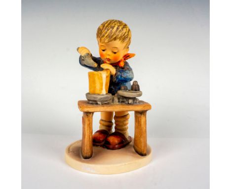 Hand painted in matte finish. Depicts a young working boy measuring out flour. Goebel backstamp. Issued: 20th centuryDimensio