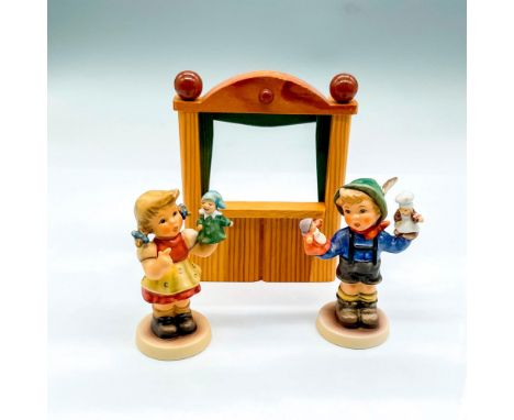 Includes First Edition 2004 hand painted boy and girl holding hand puppets. Goebel Germany backstamp. With wood stage. Issued